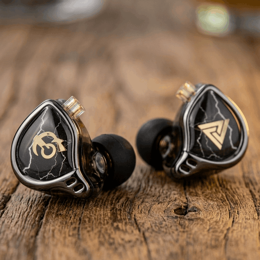THE VOLTRAY VAULT QKZ X HBB in-ear monitors with black and silver design, featuring a lightning pattern and logo.