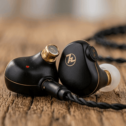 Linsoul 7HZ G1 in-ear monitors with a sleek black design, gold accents, and detachable cable on a wooden surface.