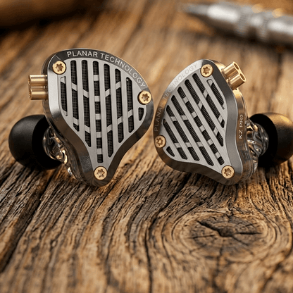 KZ PR3 earphones with a unique triangular design, featuring a metal grille and gold accents on a wooden surface.