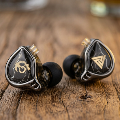 THE VOLTRAY VAULT QKZ X HBB in-ear monitors with black and silver design, featuring a lightning pattern and logo.