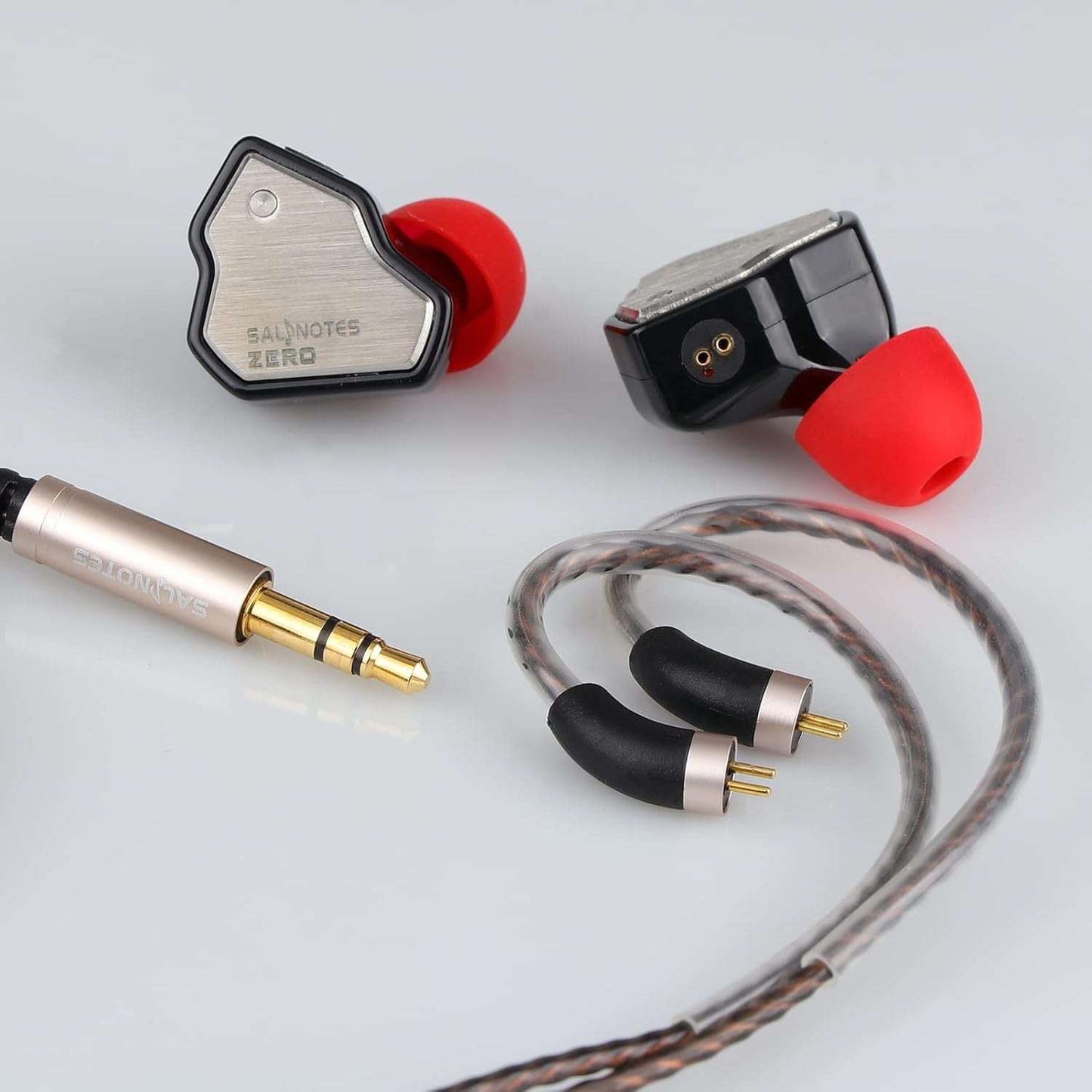 Salnotes Zero in-ear monitors with red ear tips, silver faceplates, detachable cables, and gold-plated audio jack.