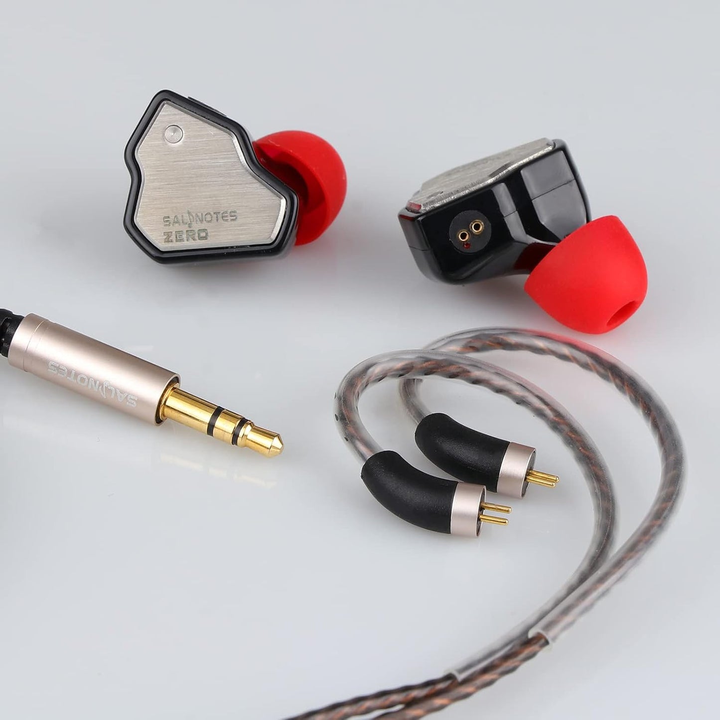 Salnotes Zero in-ear monitors with red ear tips, silver faceplates, detachable cables, and gold-plated audio jack.